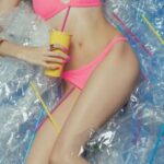 Inflatable Drink Holders - Woman in Pink Bikini Lying on Blue Inflatable Pool