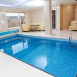 Solar Pool Lights - Beige Leather Sofa Near Pool