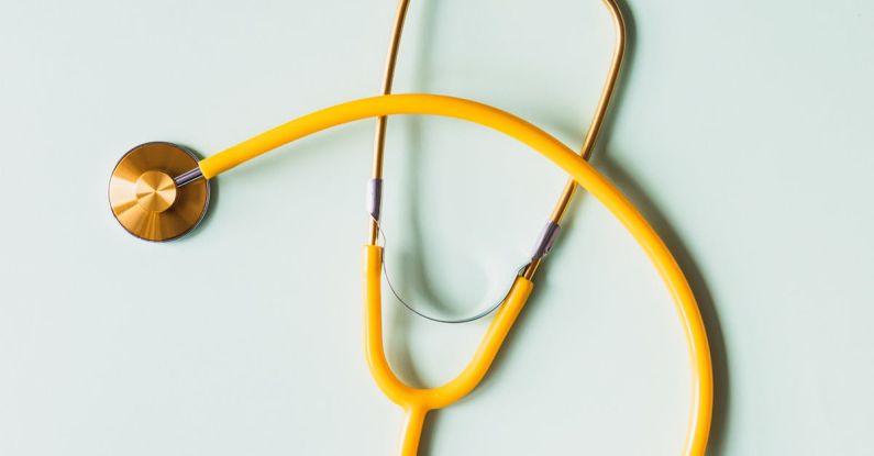 Prevent Algae - Top view of yellow medical stethoscope placed on white surface during coronavirus pandemic