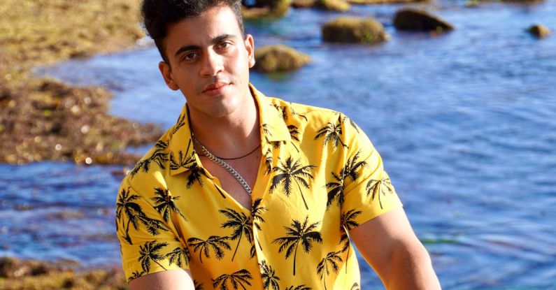 Water Polo Drills - A Man in the Beach Wearing Hawaiian Polo