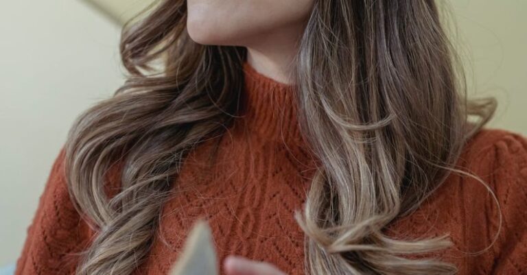 Open Turn Flip Turn - Low angle of positive female with long wavy hair turning page of opened book while reading