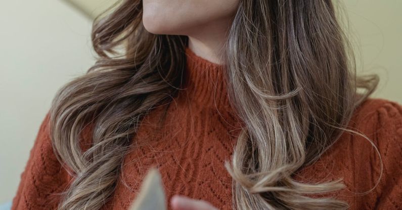 Open Turn Flip Turn - Low angle of positive female with long wavy hair turning page of opened book while reading
