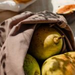 Eco-Friendly Filters - Bags with Fresh Fruits and a Glass of Water Standing in Sunlight