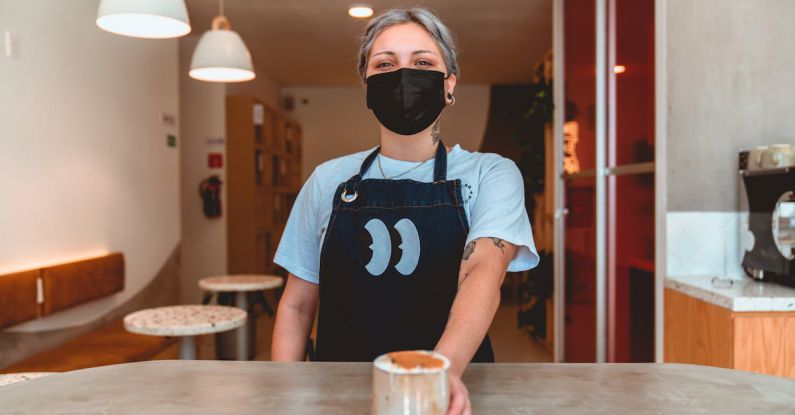 Safety Precautions - Photo of Barista Serving Iced Coffee