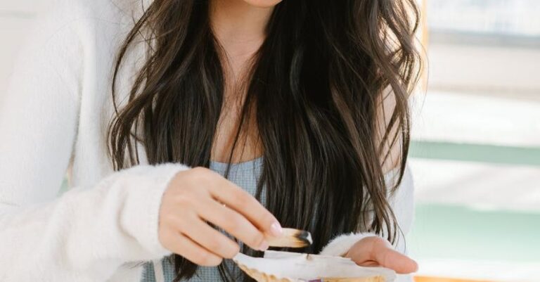 Mental Preparation - Serious Asian woman with palo santo and seashell preparing for spiritual stress relief session