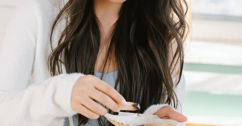 Mental Preparation - Serious Asian woman with palo santo and seashell preparing for spiritual stress relief session