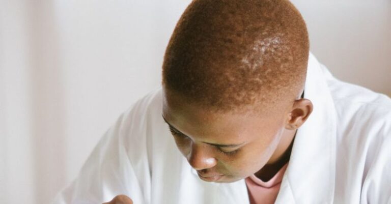 Video Analysis - Focused African American technical worker replacing faulty elements on video card