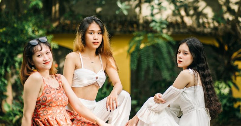 Poolside Vegetation - Asian women near swimming pool