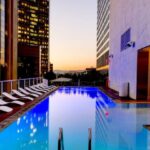 Illuminated Pool Toys - White Sunloungers Beside Pool